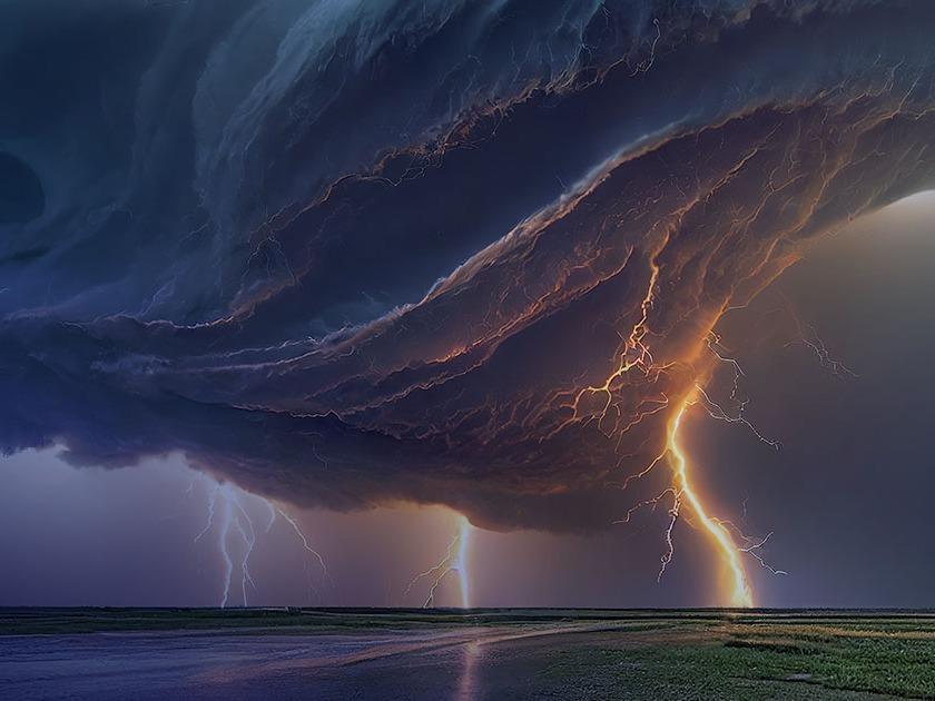 Dramatic stormy sky with swirling dark clouds and multiple bright lightning strikes over an open field.